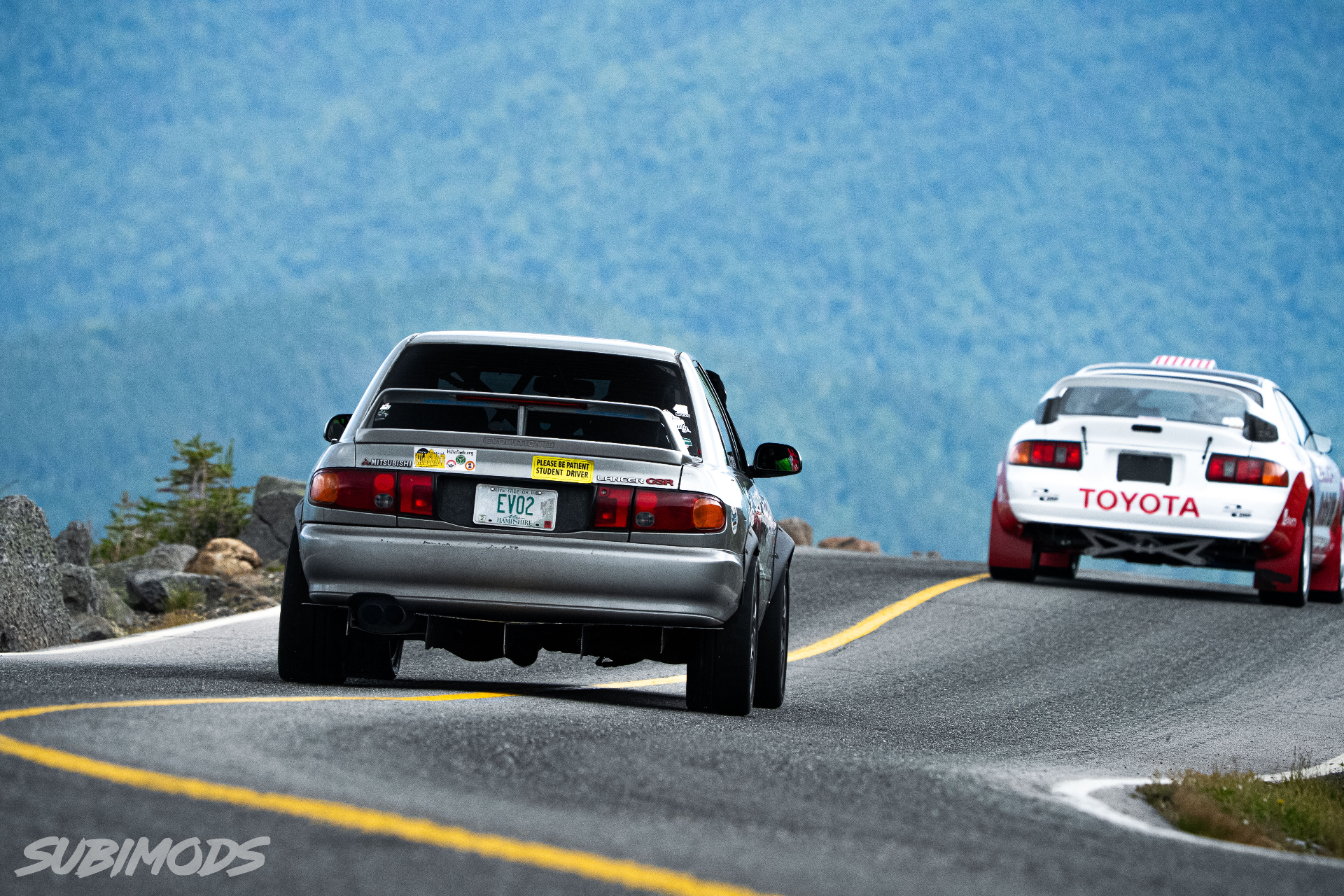 The grey Wilcox Motorsports Evolution leading a competitor uphill