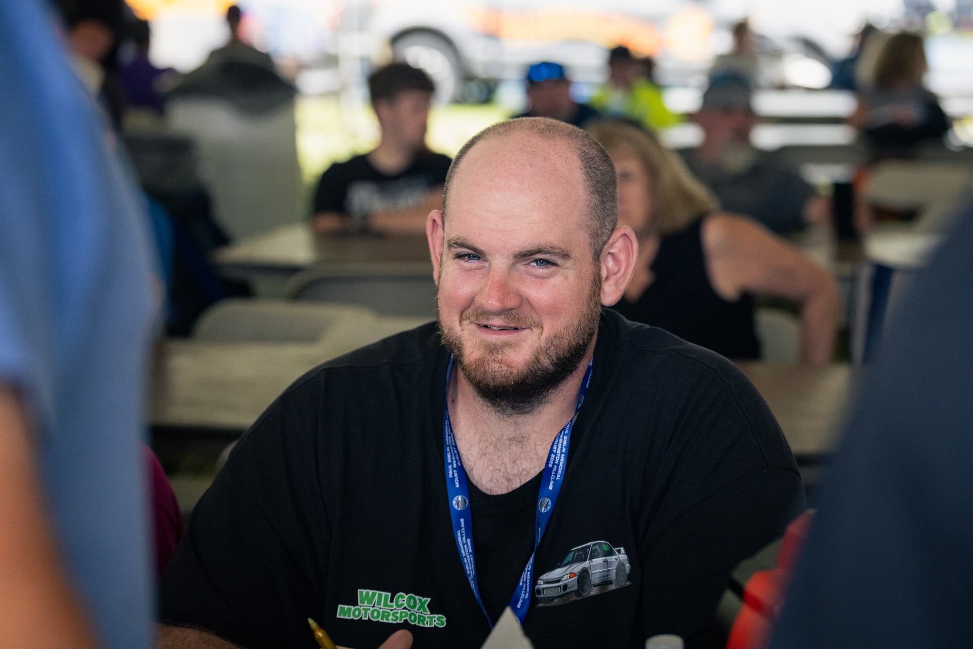 Gregory Wilcox at the Climb to the Clouds drivers' meeting, wearing a Wilcox Motorsports shirt